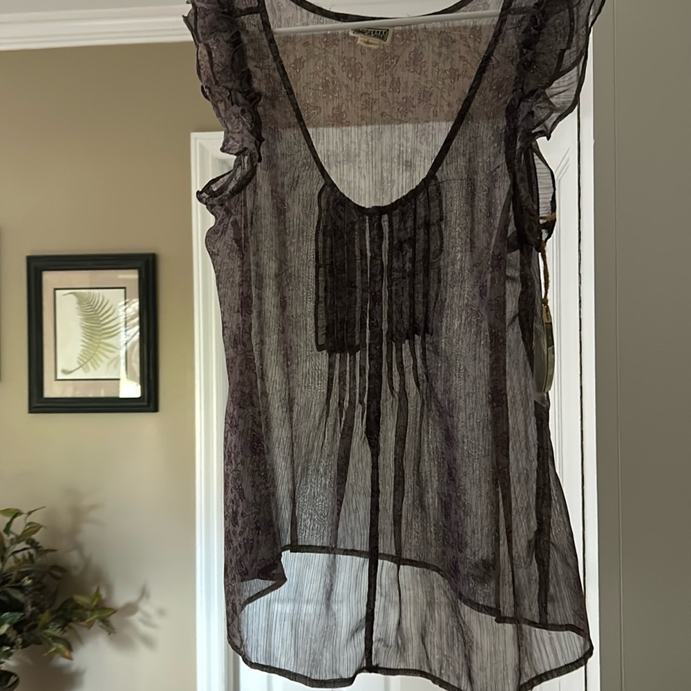 Brand new sheer purple pleated blouse with ruffled sleeves in five snap front